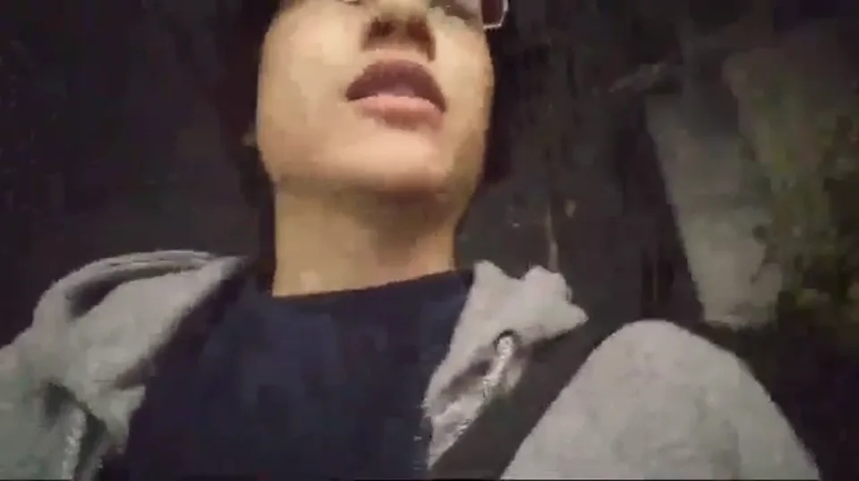 Daniel filming himself while walking outdoors at night during the 2017 livestream